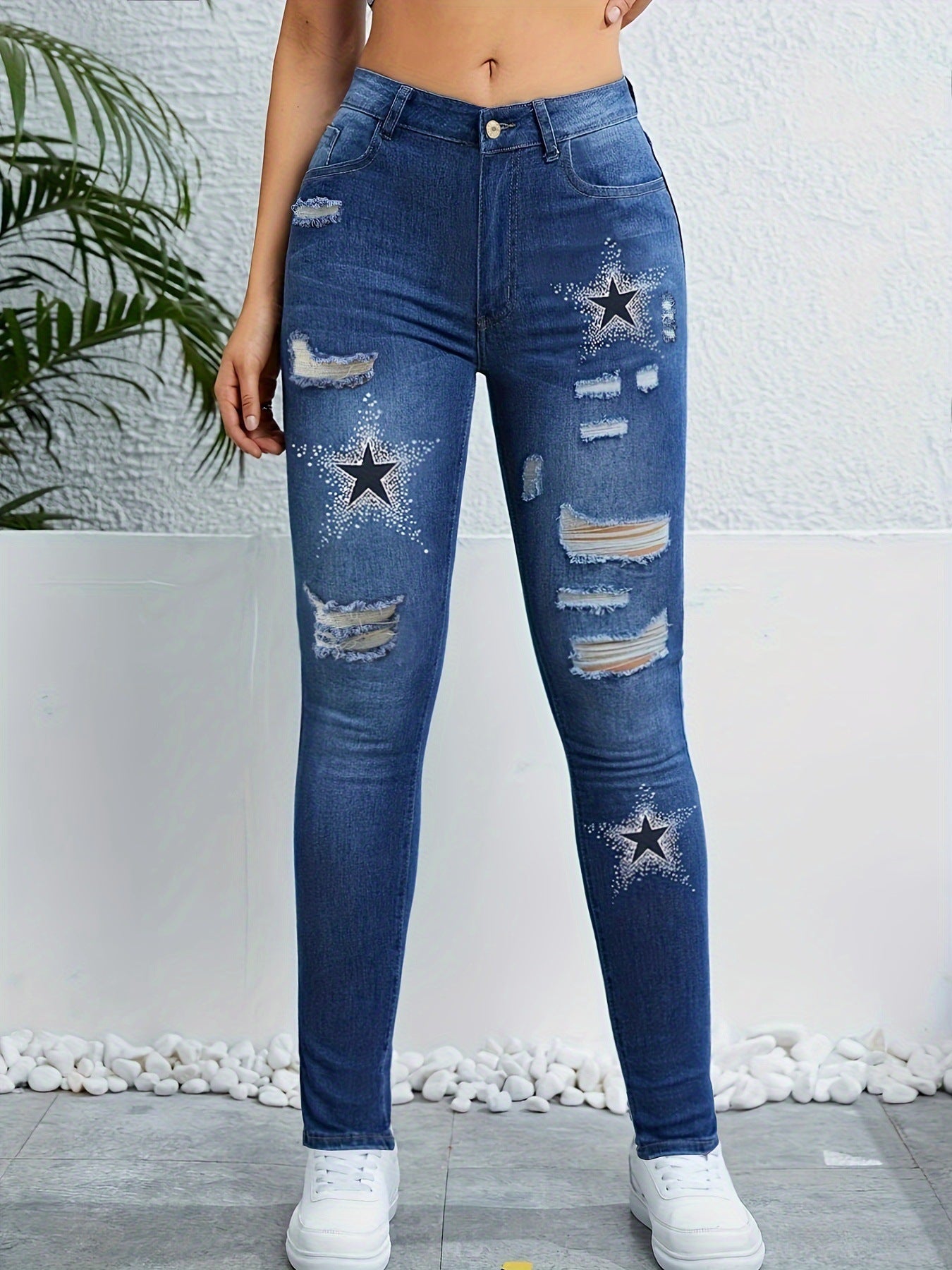 Star-Print Ripped Skinny Jeans.